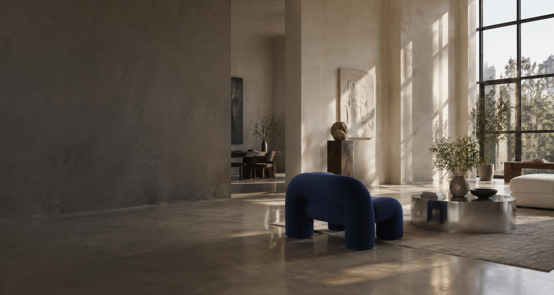 Sunlit design studio with sculptural furniture and a blue lounge chair